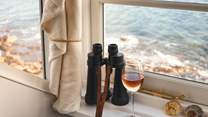 Sneak a peek with the binoculars, with vast ocean vistas you'll have plenty to discover