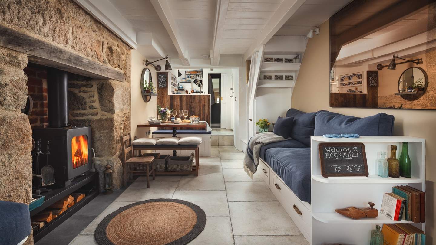 Spend magical evenings fireside after enjoying a delicious feast in this snug open-plan kitchen, dining and living area