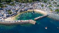 This stunning aerial shot of Mousehole is just a sneak peek into the magical which awaits you at this quaint Cornish fishing village...
