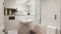The first floor family bathroom with overhead shower