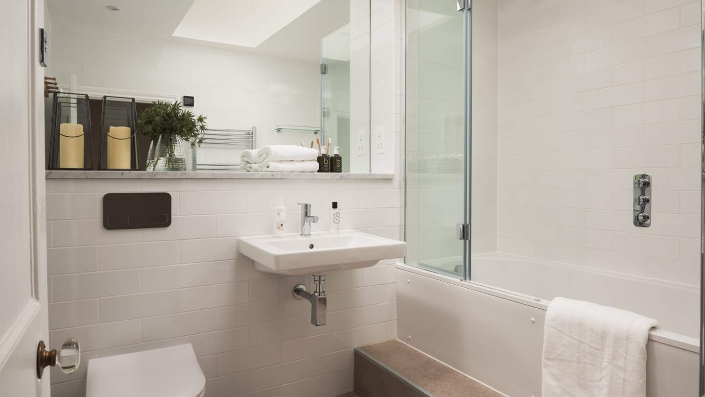The first floor family bathroom with overhead shower