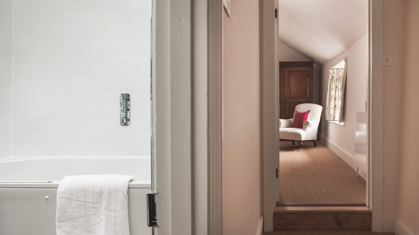 Bedroom one is set at the end of the upstairs hallway, adjacent to the family bathroom