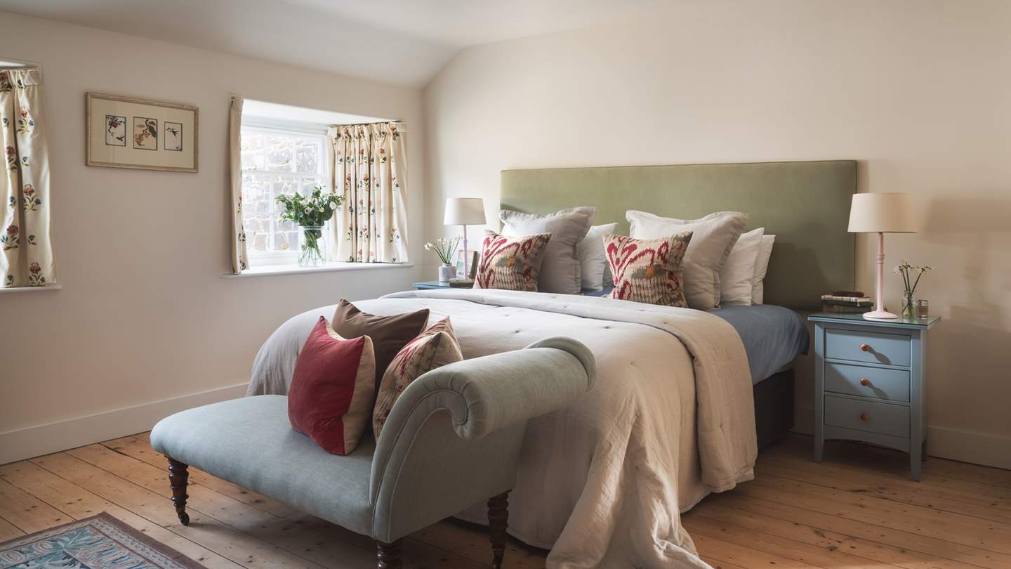 Spacious bedroom four which can be set as a super-king bed or twin beds