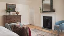Bedroom four has lovely original features such as the fireplace and plenty of storage