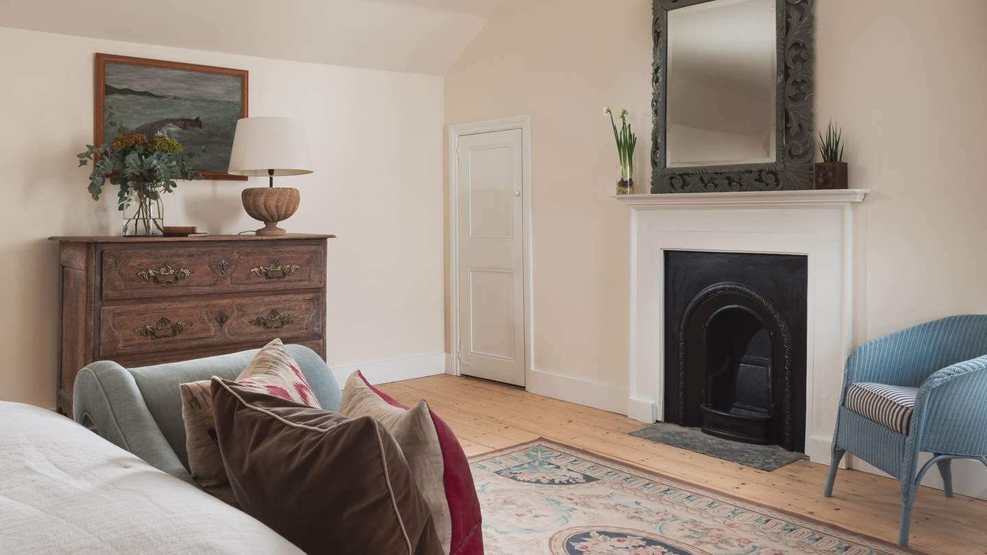 Bedroom four has lovely original features such as the fireplace and plenty of storage
