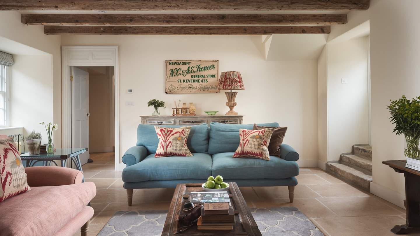 The spacious sitting room in pretty pastel shades