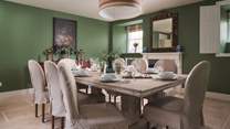 We adore the elegant dining room perfect for family feasting, adorned with vintage touches and antique treasures