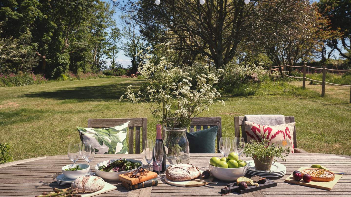 The tranquil garden, adjacent to the barbecue and outdoor dining area
