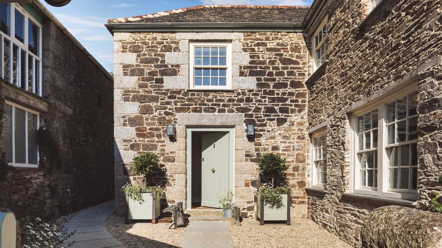 Nestled in the heart of rolling Cornish countryside, you'll uncover rustic luxury at decadent Tremayne Farmhouse