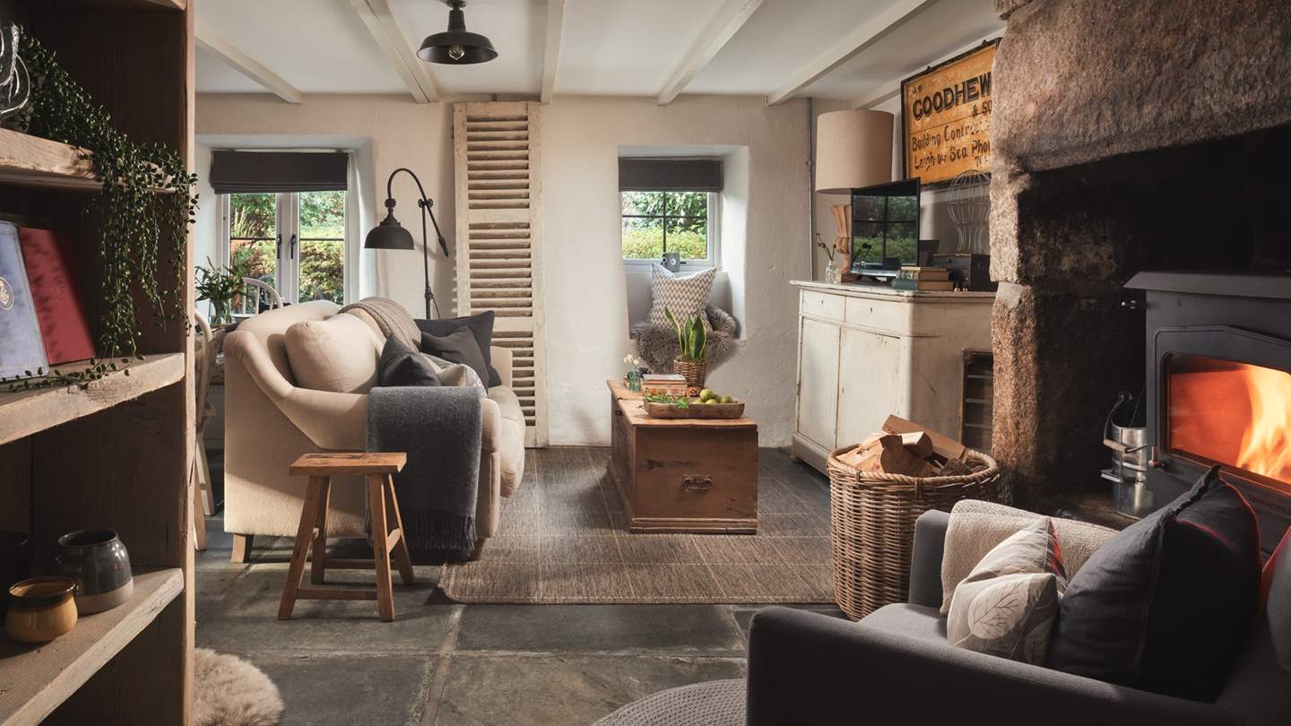 With a cosy wood burner, large open stone fireplace, flagstone floor and beamed ceiling, it's quintessentially country chic