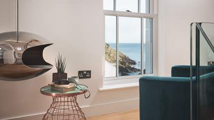 The silver Cocoon bio-fuel burner creates a cosy ambience for moments sea gazing