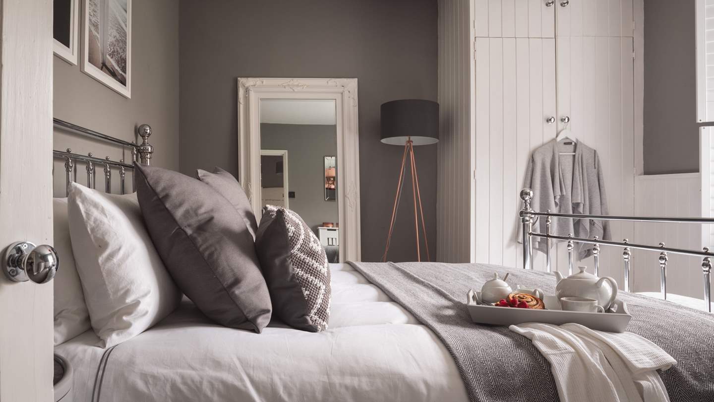 Each bed is swathed in luxurious linens, bedding, cushions and throws