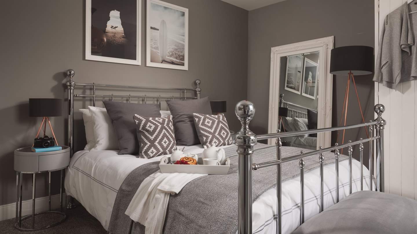 The master bedroom has a lovely bed knobs-and-broomsticks type king size bed, perfect for long, luxurious lie-ins