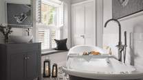 We just love the monochrome tones of the marvellous bathroom