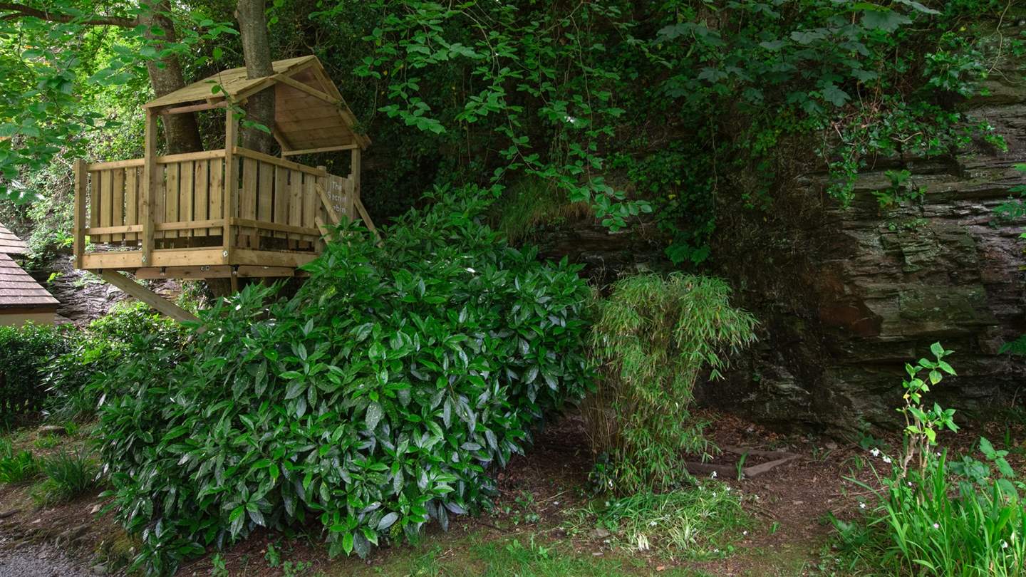 With a secret treehouse for playful afternoons in the beautiful garden...