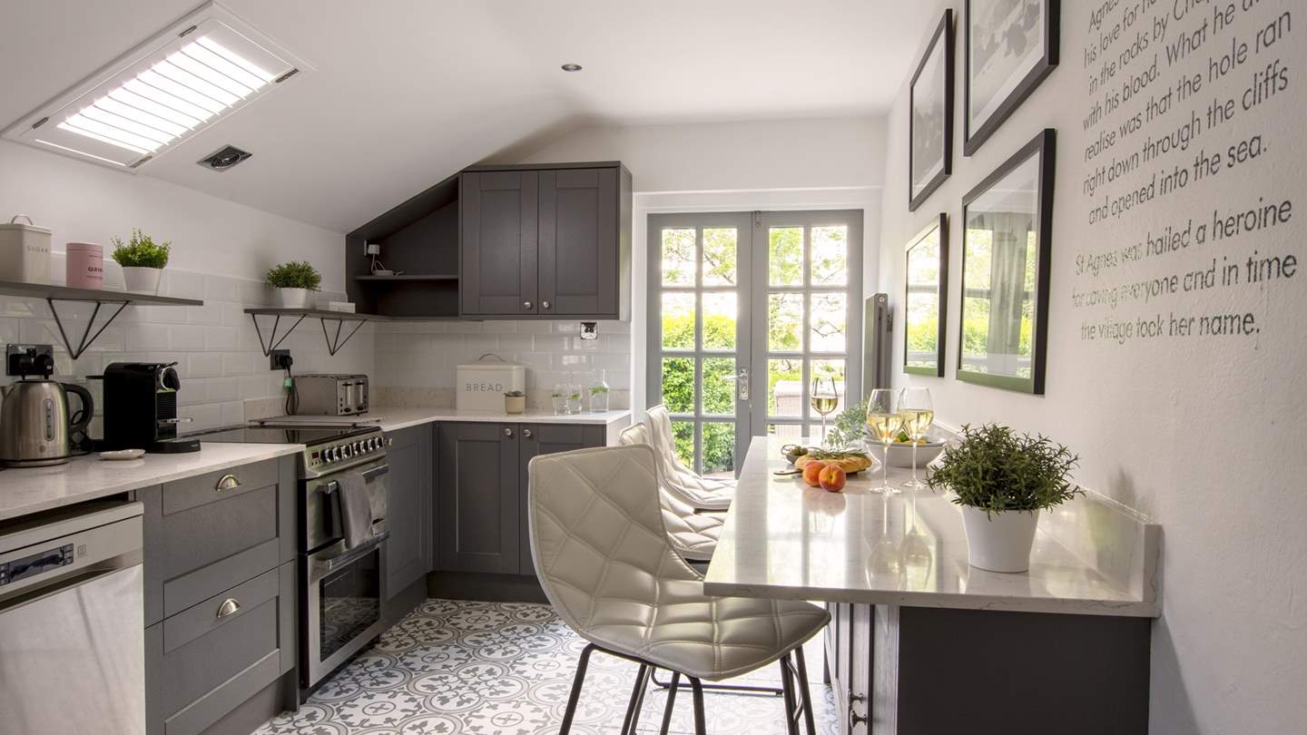 The kitchen is a bright, light space filled with everything you need to rustle up meals, whether it's a quick snack or a feast...