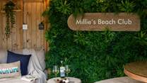 While away perfect afternoons in the botanical themed beauty of Millie's Beach Club...