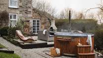 Alfresco living is simply a dream at Carn Cottage, with a wonderful addition of a wood-fired hot tub