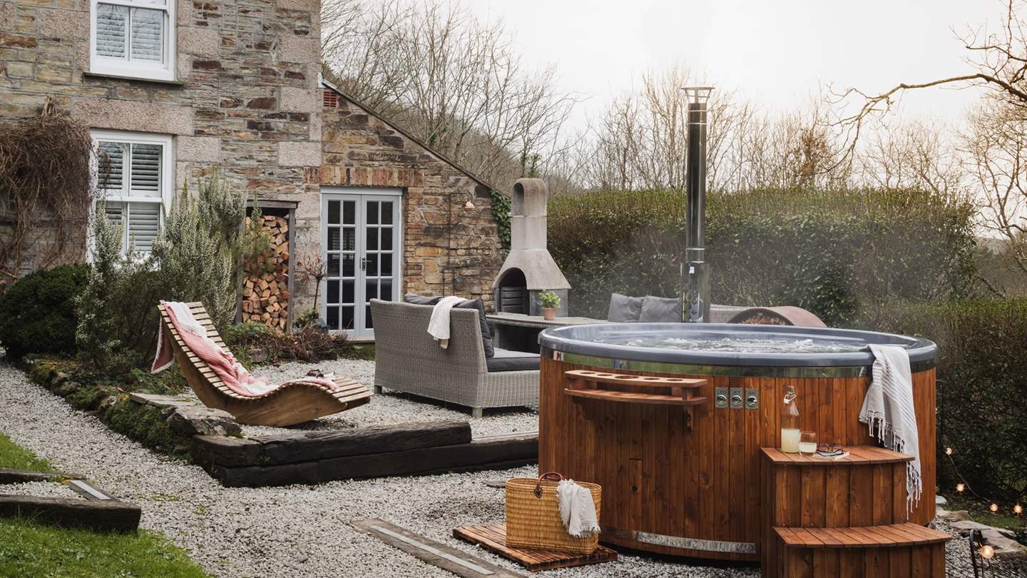 Alfresco living is simply a dream at Carn Cottage, with a wonderful addition of a wood-fired hot tub