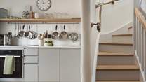 The sweetly simple galley kitchen is equipped with all the essentials