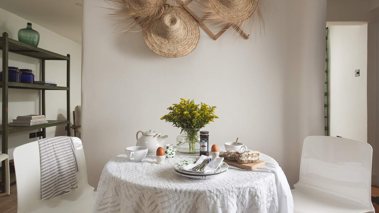 The round dining table seats four - perfect for mealtime - whilst there's outside dining too during the summer months