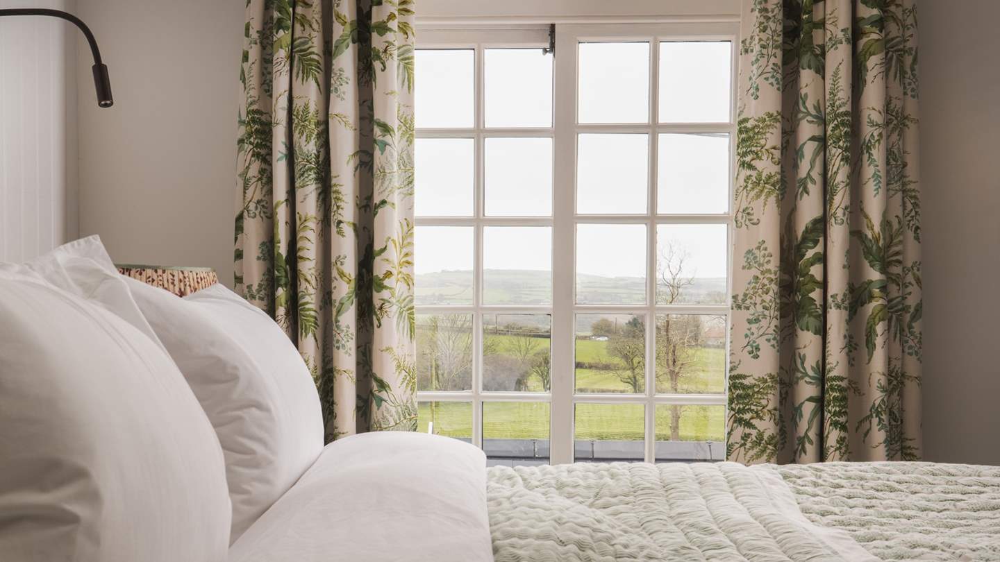 Pretty countryside views can be gazed at from the comfort of your bed