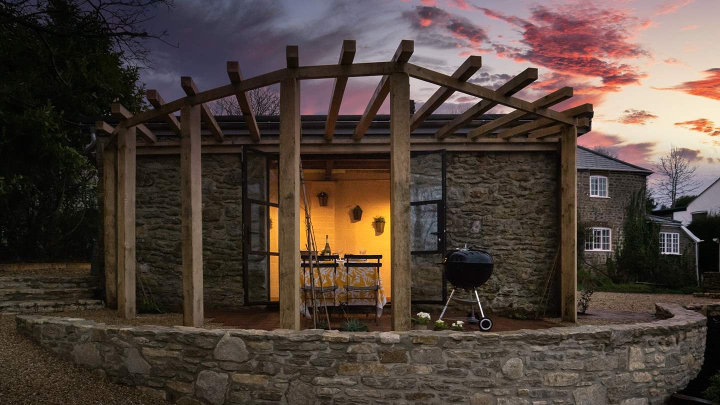 The idyllic cobbled stone garden room is just across the quaint country lane from the cottage