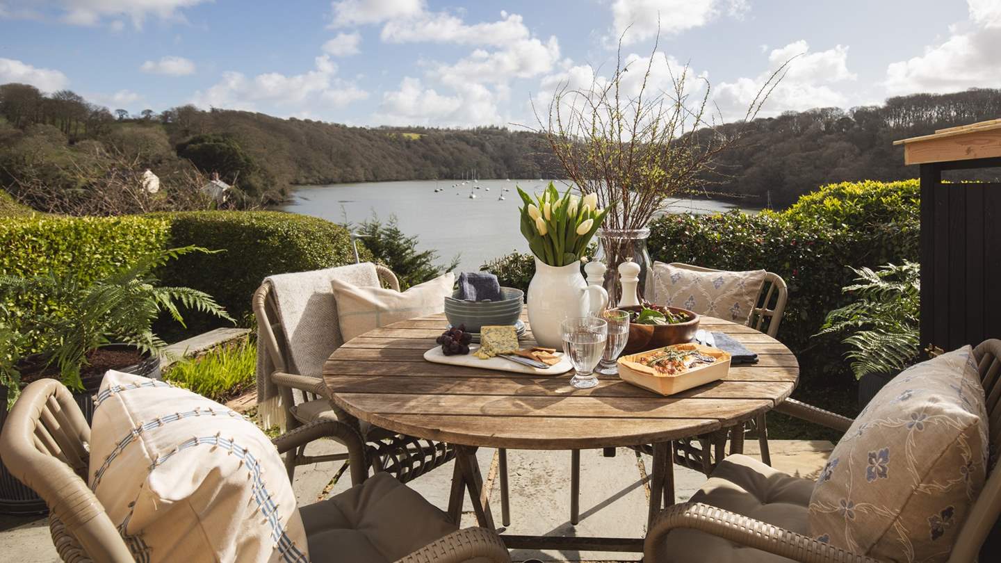 To the front of the property, overlooking the rivers, is a glorious sun-soaked terrace