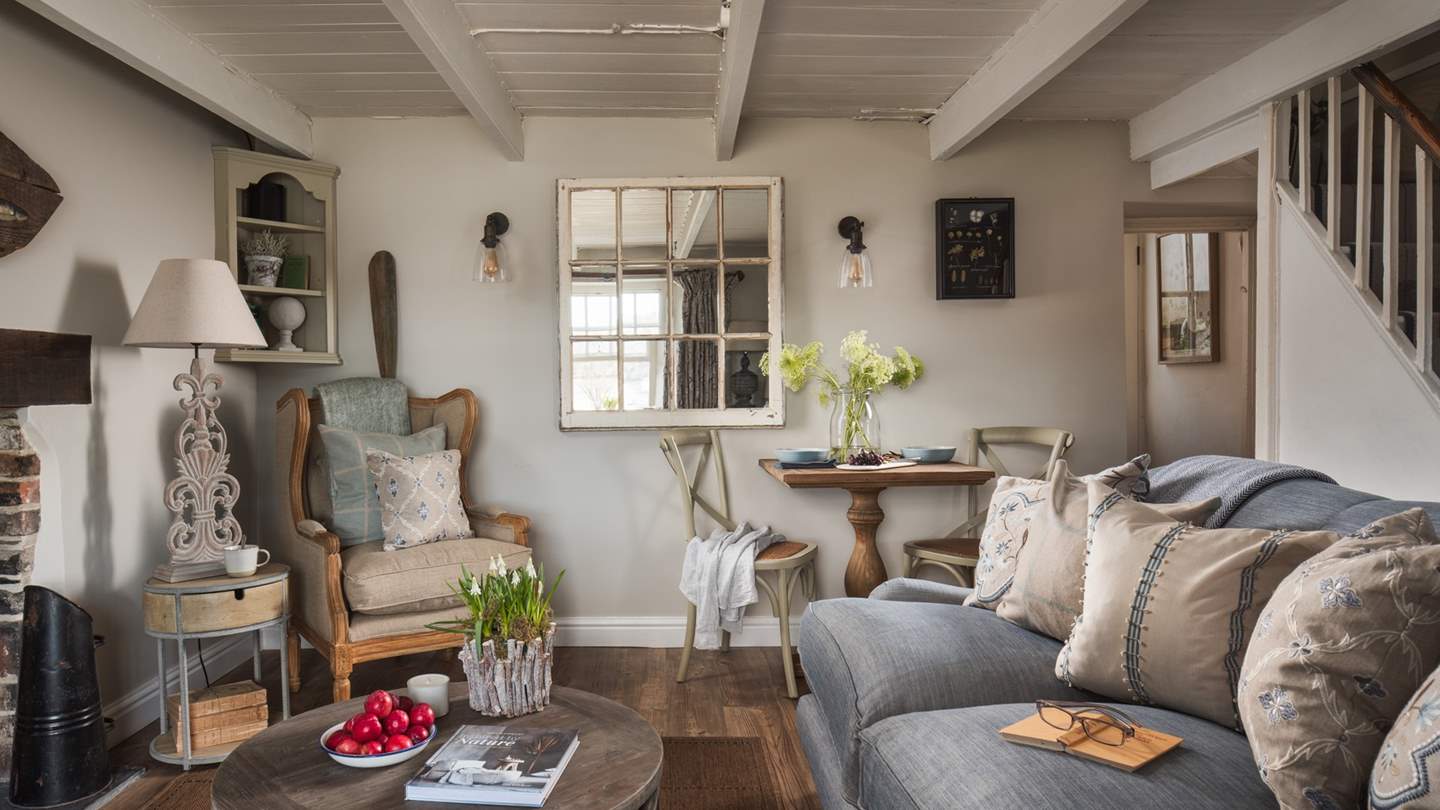 There's a fabulous sofa to sprawl on and we just love the occasional chair - the ideal corner to cosy up with a good book