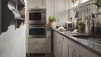 The galley-style kitchen is perfectly equipped to rustle up meals for you and your loved one