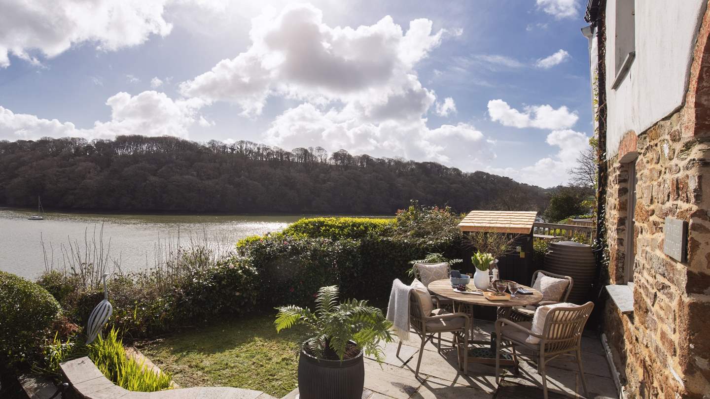 The terrace comes complete with a teak table, chairs and parasol for alfresco dining and a large Webber kettle barbeque