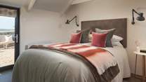 You’ll find the sumptuous bedroom, with a super comfy king size bed, lovingly adorned in the cosiest cushions and throws