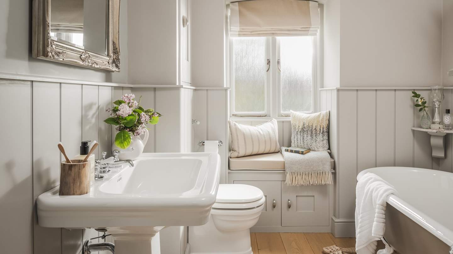 The family bathroom on the ground floor has a stunning clawfoot bath for long soaks and a shower over it