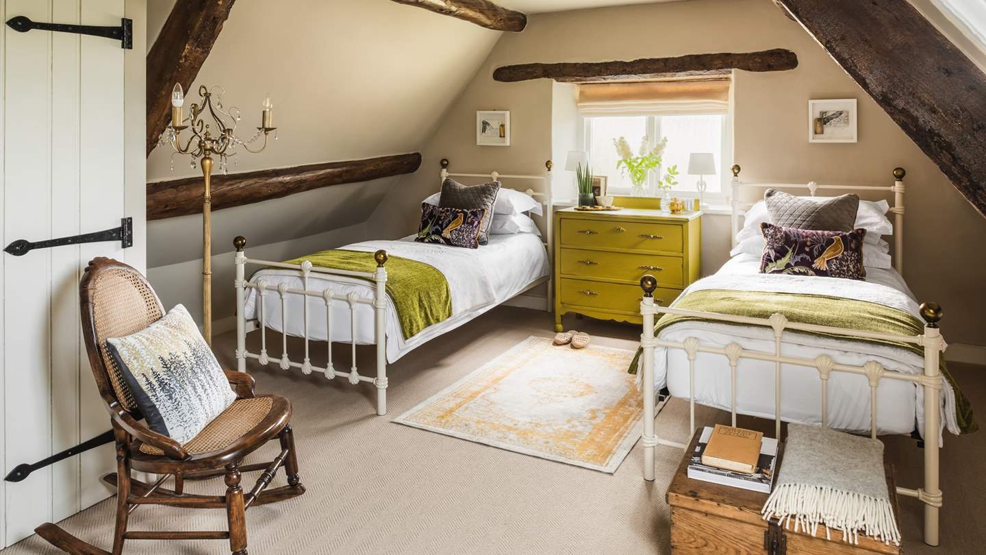 Take the stairs up to the pretty second bedroom, tucked amongst the eaves