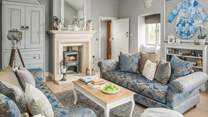 Just wow! The luxurious sitting room is just the place for long chats or just a snooze by the fire