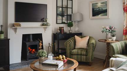 A dream in every season, the cosy downstairs sitting room is a cocoon of comfort and calm