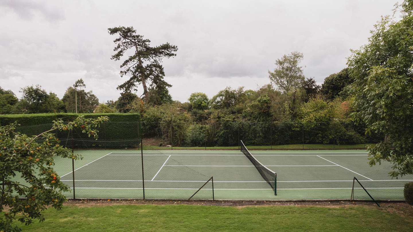 The tennis court and bubbling hot tub are available for your exclusive use
