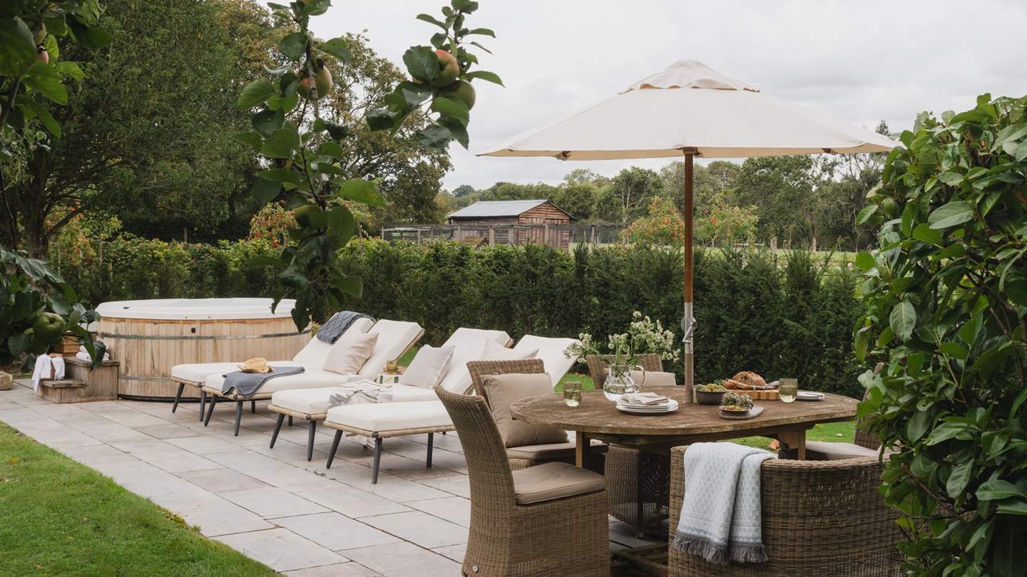 The addition of a private terrace beside the tennis court with lounge seating, large Weber kettle charcoal barbecue and dining set that promises the perfect setting for sun-soaked afternoons and evenings under the stars