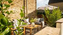 The bijoux south facing courtyard garden is just the perfect spot to relax in