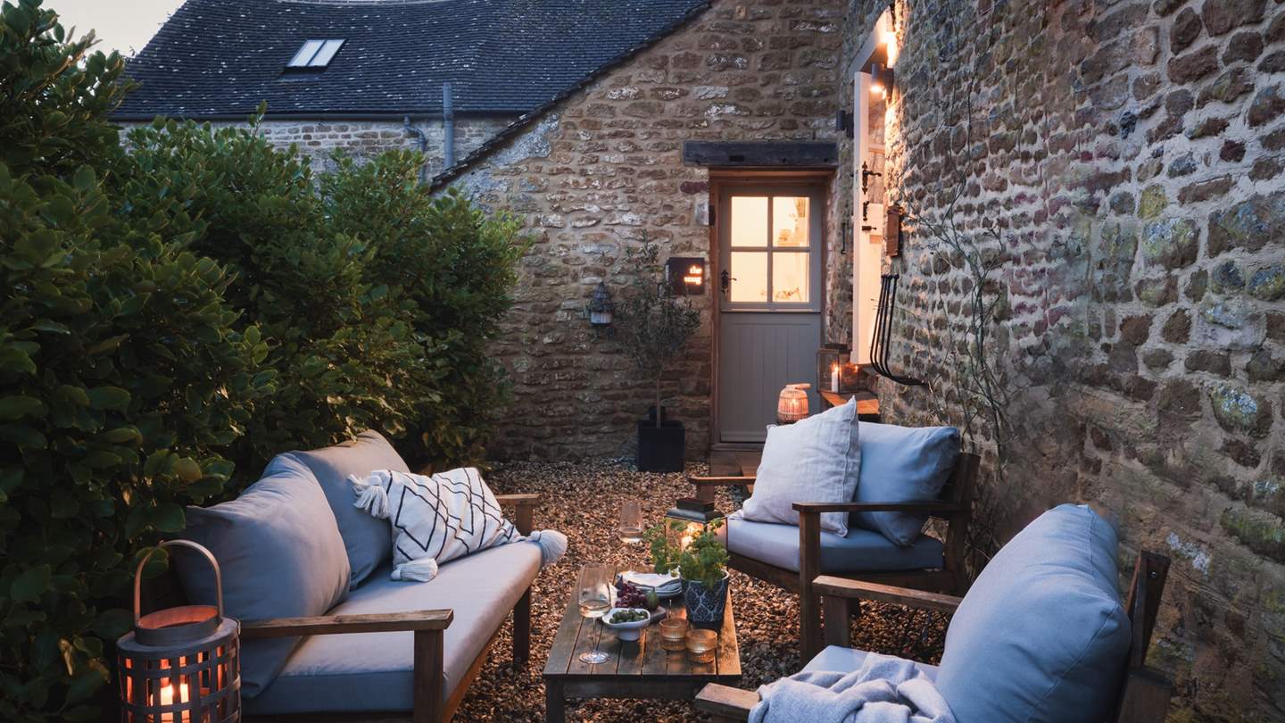 A dreamy spot on dusky evenings - please note the outdoor furniture pictured has been replaced with two lovely teak benches...