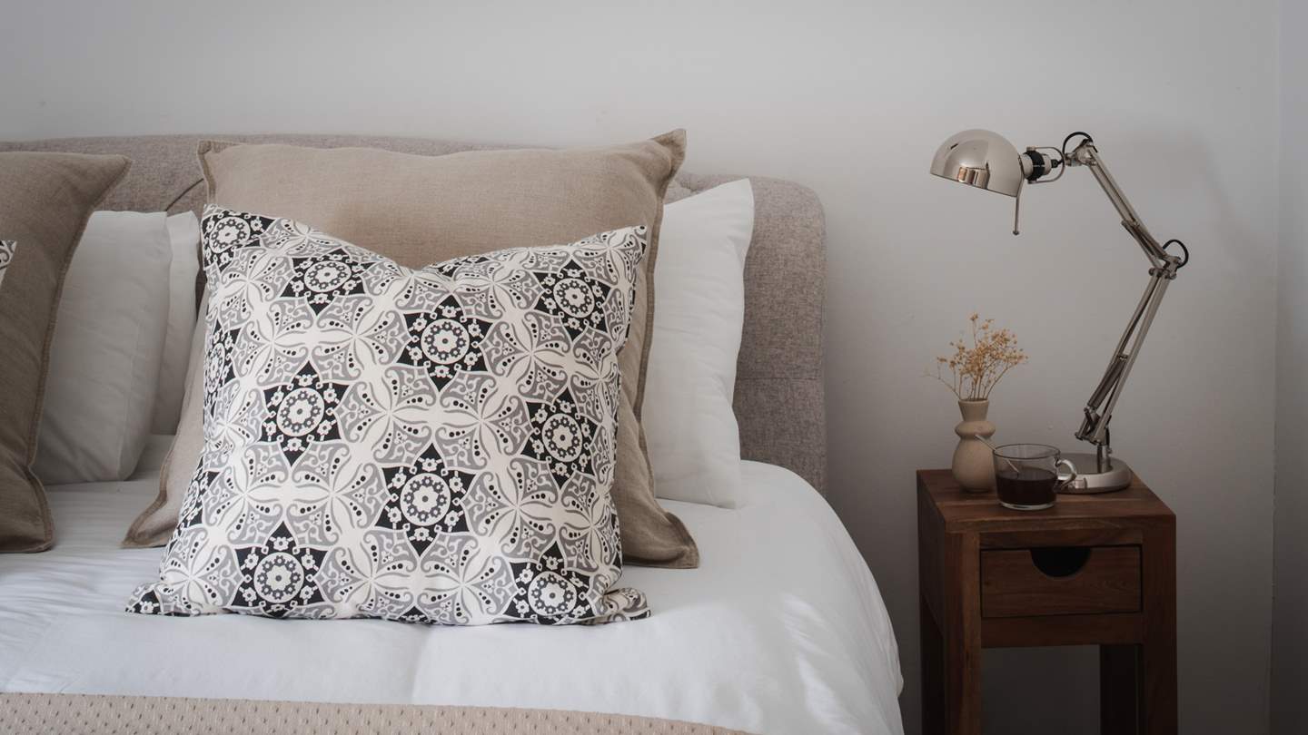 Calling for slow mornings and restful nights, the master bedroom is simply a delight