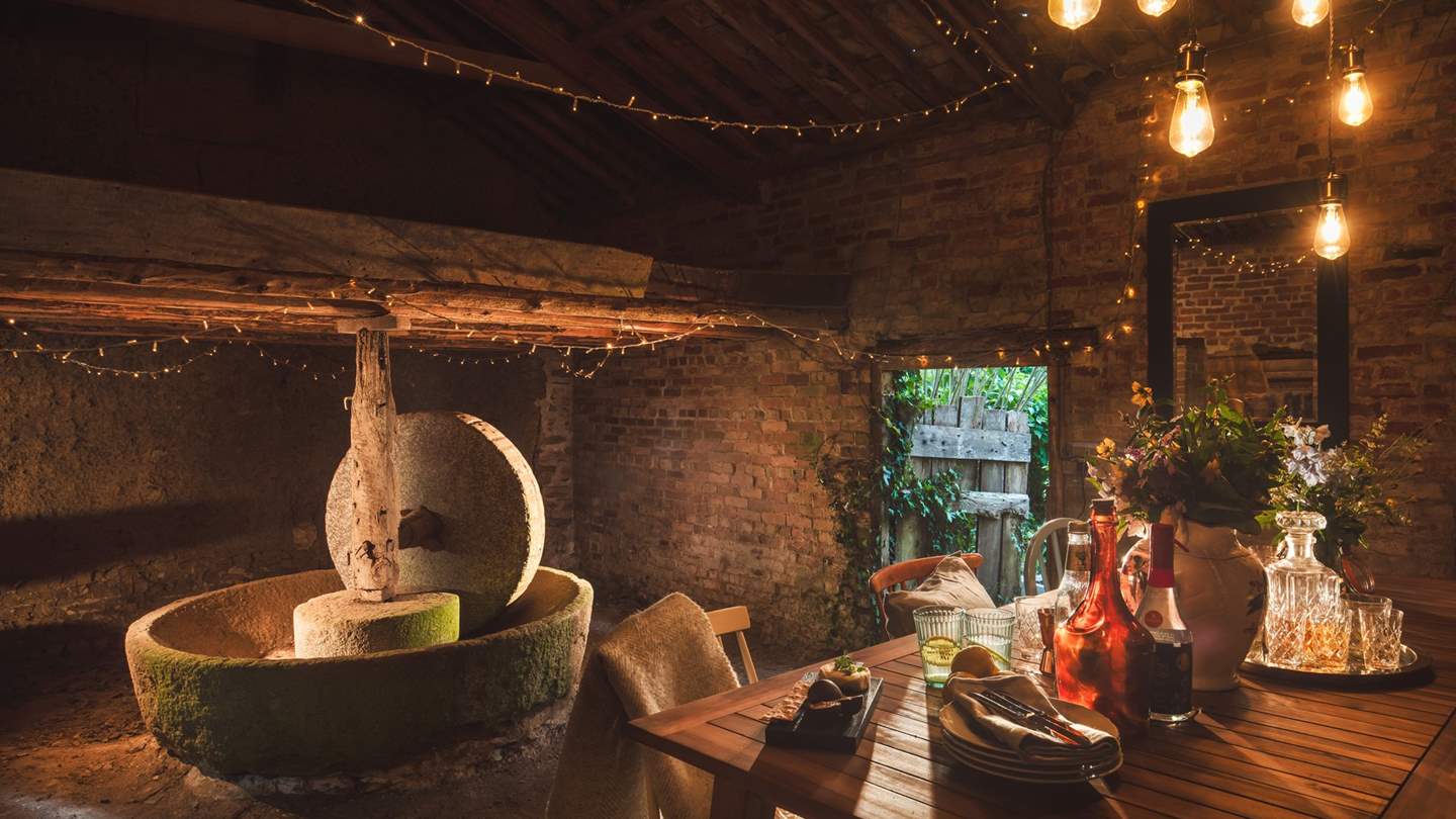 In warmer months dine in the adjacent cider barn, where you can sit next to the original apple press amongst the fairy lights