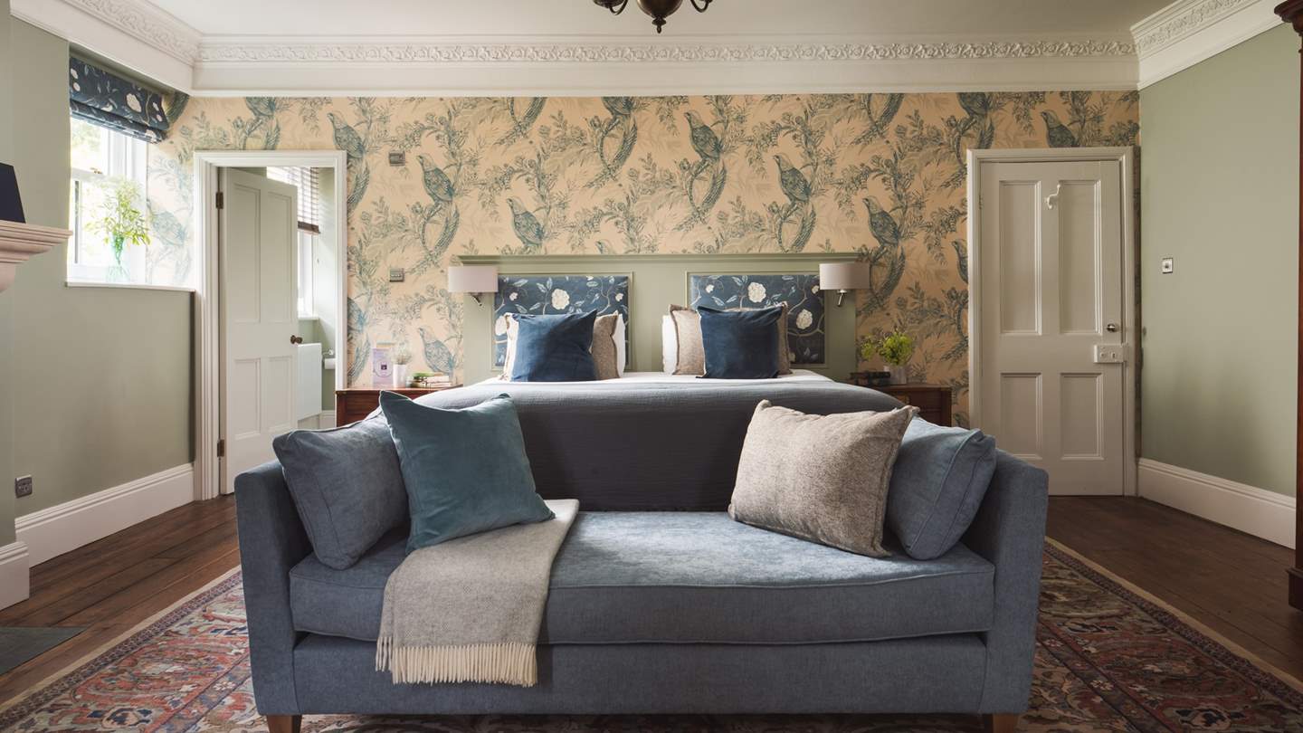 The master bedroom boasts an en suite with both bath and shower