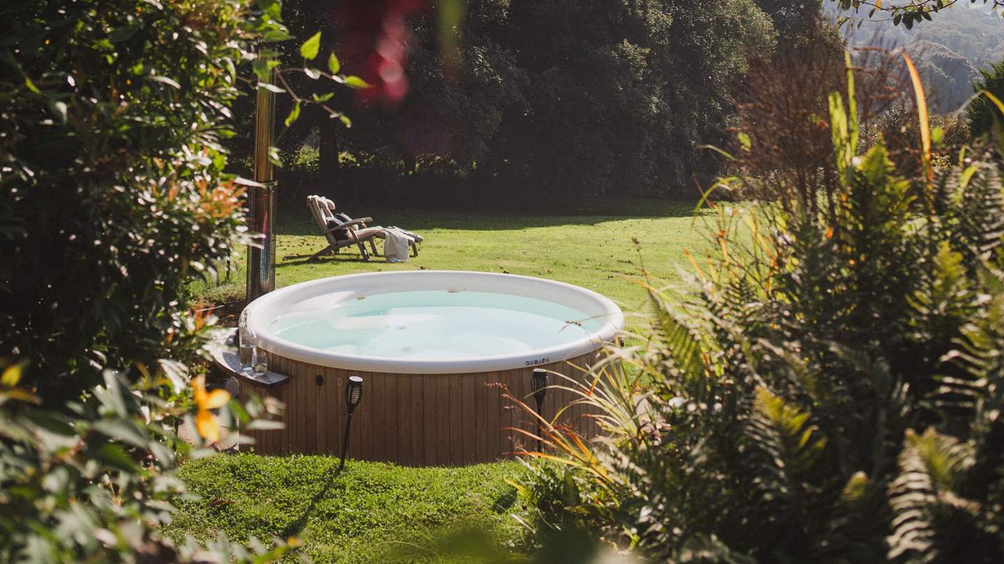 The luxurious Skargards hot tub from Sweden, welcoming up to eight people. By being wood fired, it can be totally silent, and you'll usually hear owls hoot at dusk