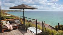 With gorgeous views over Whitsand Bay, there's a hot tub too