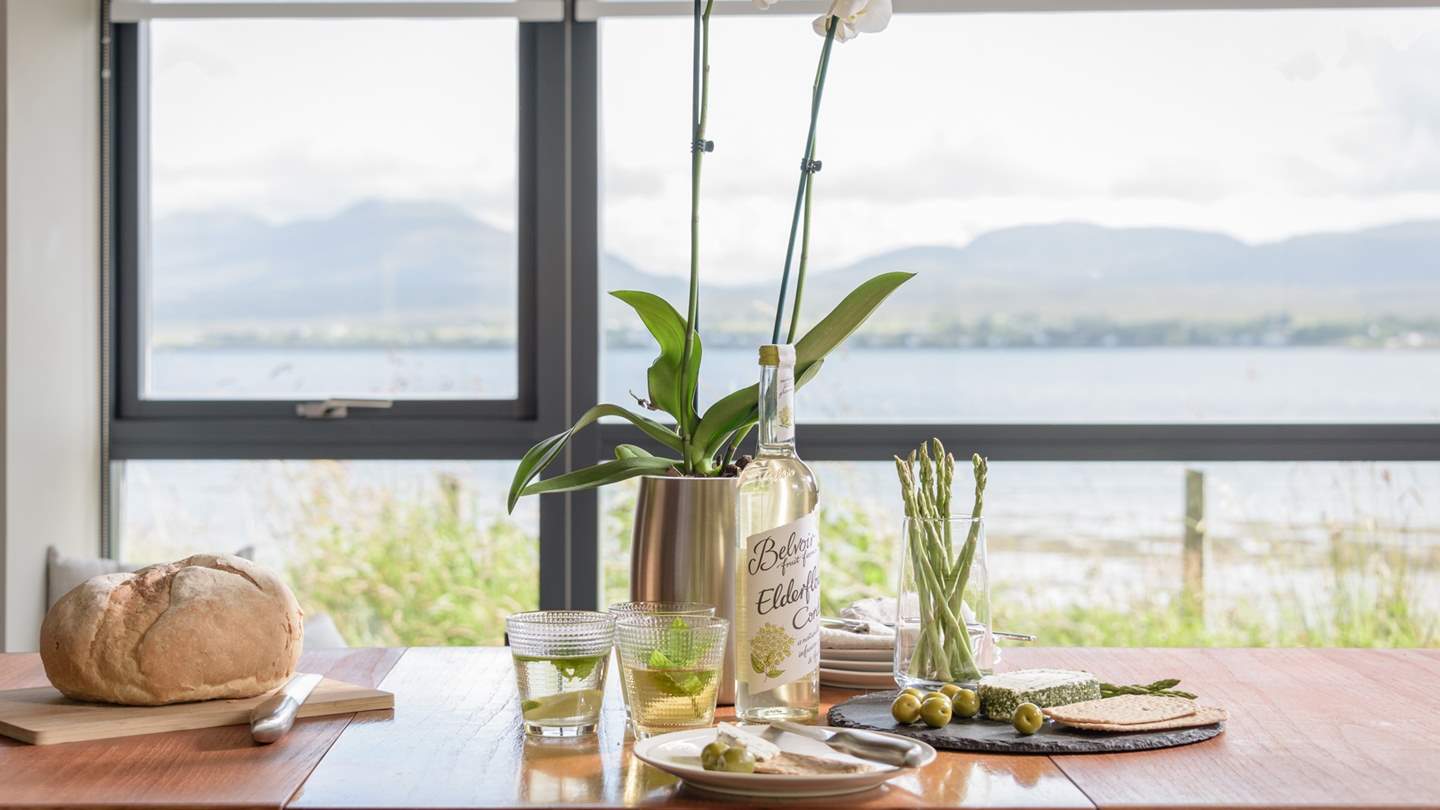 Enjoy long, leisurely meals at the vintage dining table which dates back to the 1930's, all the while gazing out over the sea