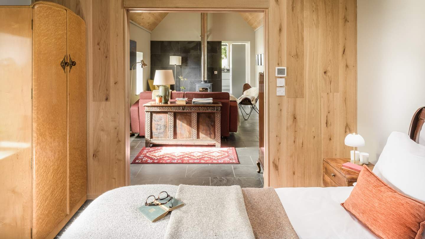 The cosy bedroom with beautiful wooden vaulted ceiling is suitably snug for blissful nights