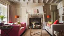 Place Barton has two sitting rooms, we just love the stone fireplace here