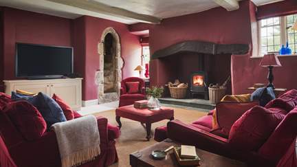 The Red Room is the second glorious sitting room and comes complete with its own small spiral staircase