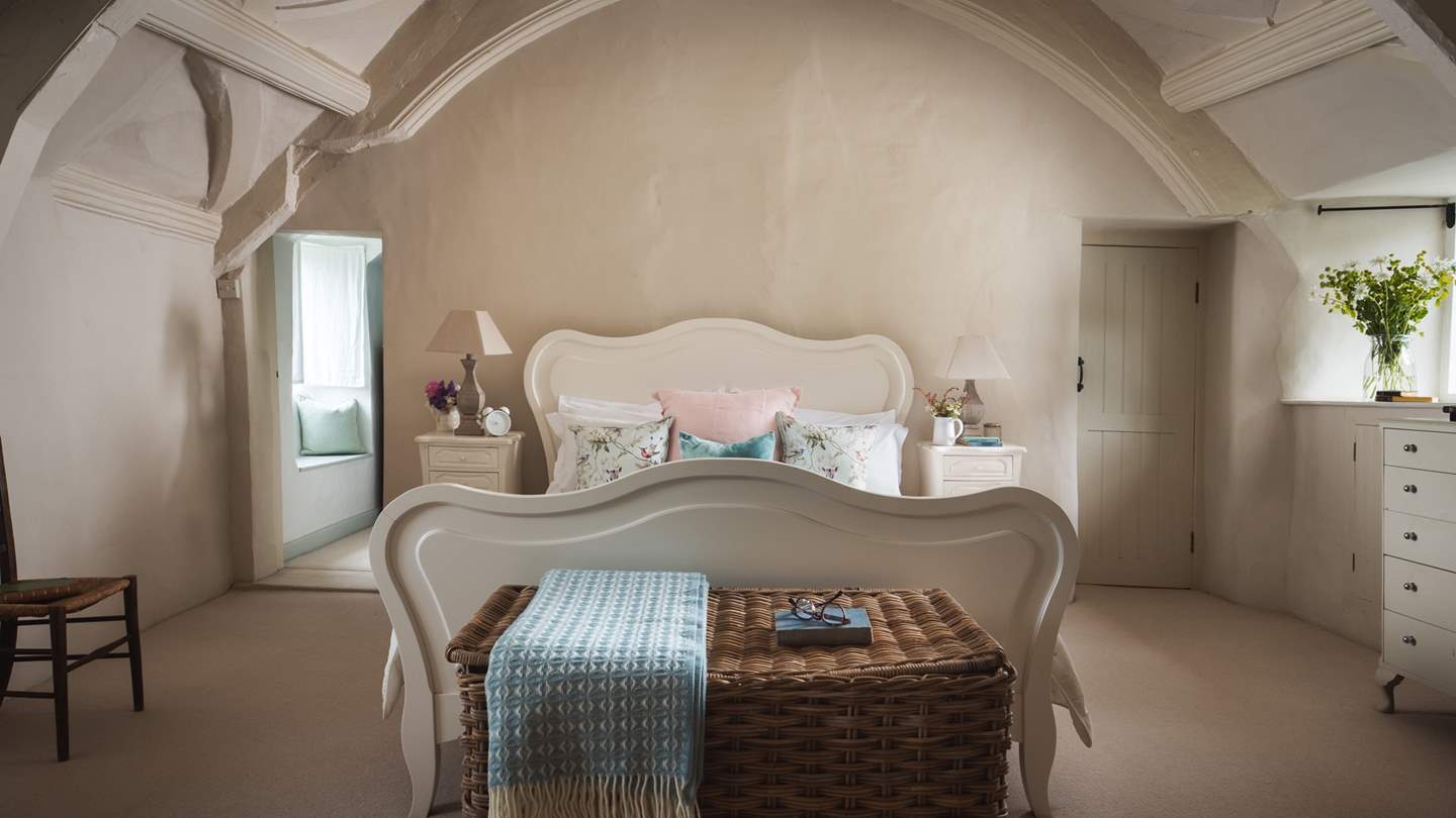 The magnificent master bedroom is just a dream with gorgeously curved beams, a heavenly French king-size bed and a dressing table